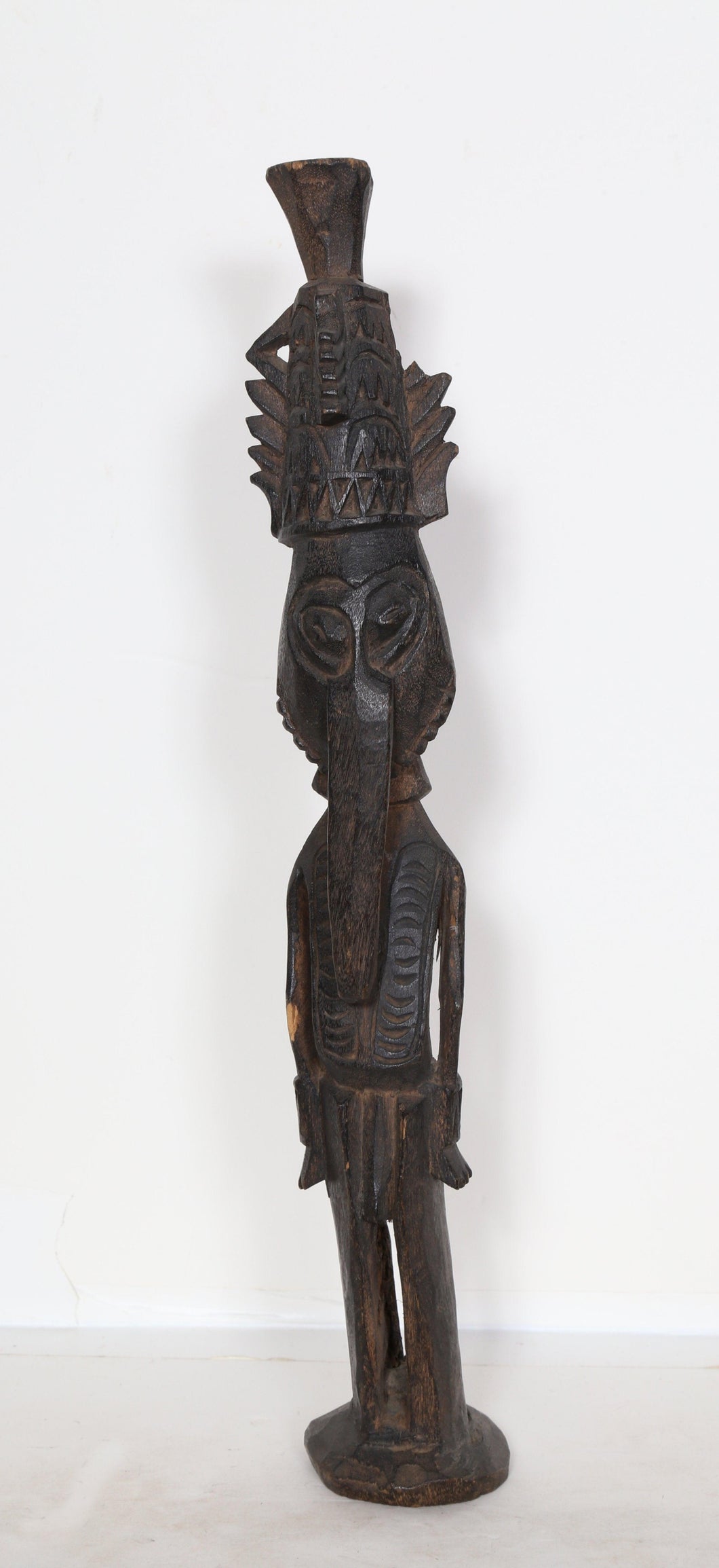 Standing Figure with Elongated Nose and Geometric Pattern Headdress Wood | African or Oceanic Objects,{{product.type}}