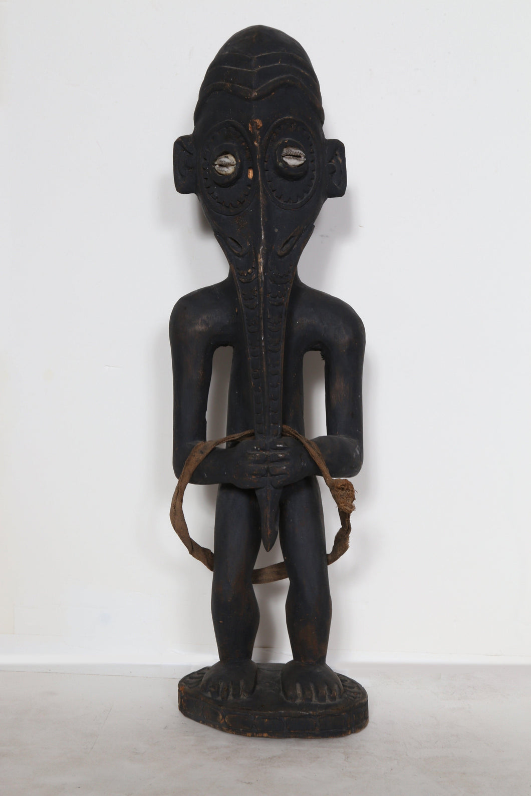 Standing Figure with Elongated Nose and Shell Eyes Wood | African or Oceanic Objects,{{product.type}}