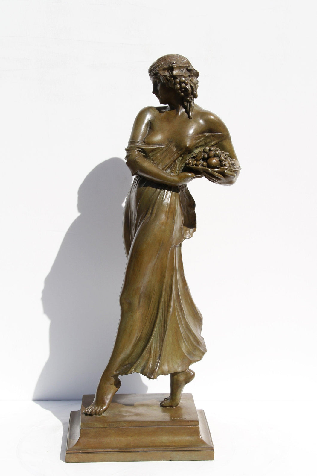 Woman carrying grapes Metal | Mario Josef Korbel,{{product.type}}